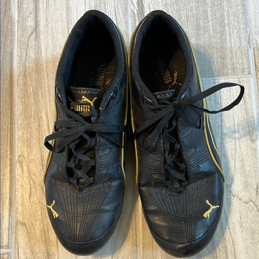 Puma Women’s Black and Gold Sneakers